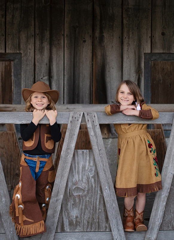 Verkleedkledij - Great Pretenders - cowboyvest en beenbeschermers - per set